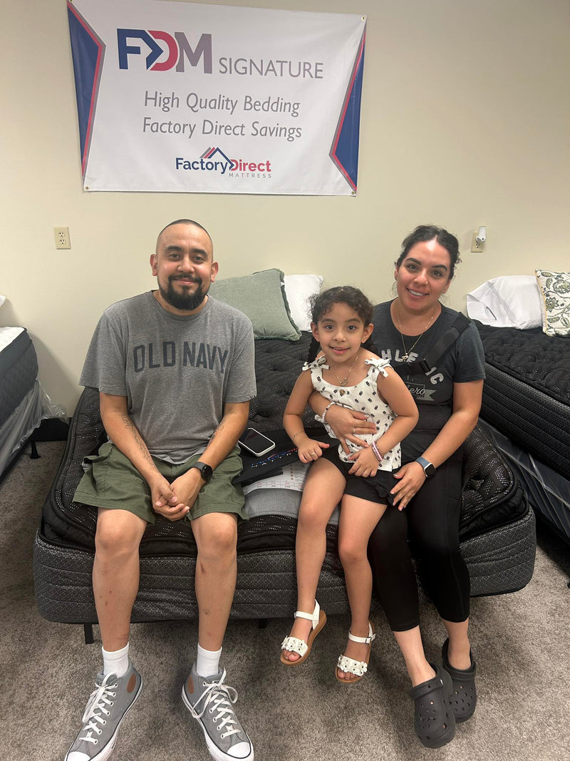 Happy family upgrading their mattress for less than the big box stores at Factory Direct Mattress KCK