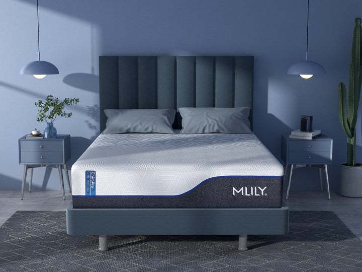 MILUY mattress in a bedroom setting with blue walls and decorative elements.