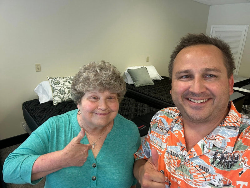 Happy Customer saving money on mattress purchase.