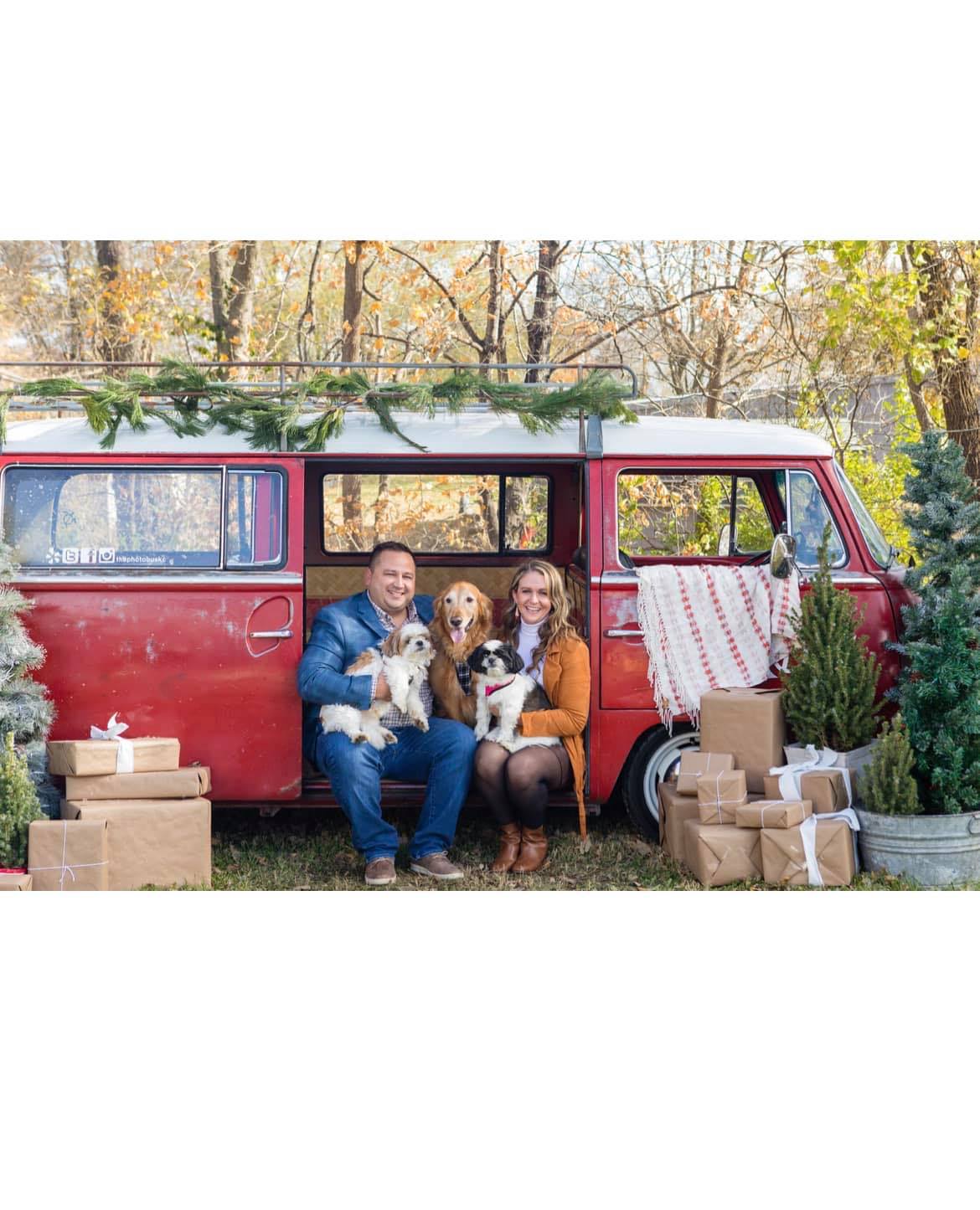 Patrick & Cortney. The owners of Factory Direct Mattress KCK with their three dogs