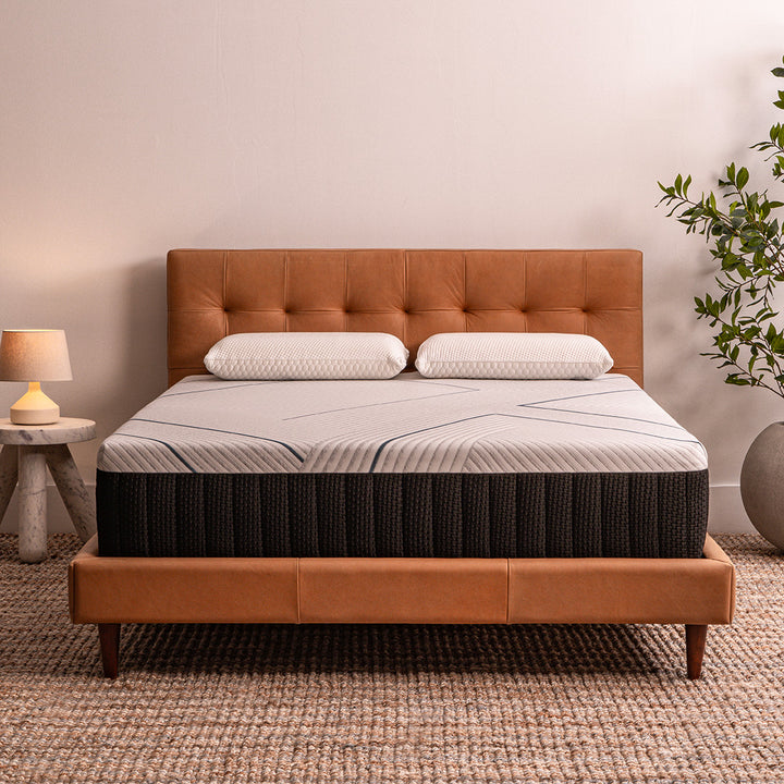 Journey Mattress from Factory Direct Mattress KCK in a room setting with a lamp and plant.