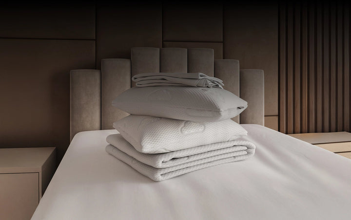 Puffy Pillows stacked on Bed
