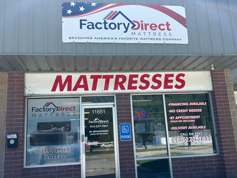Factory Direct Mattresses store front with large sign and window display.