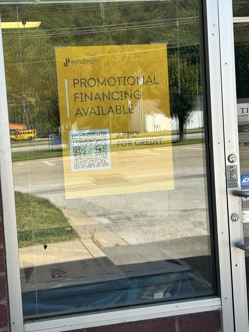 Promotional financing sign on a window  at mattress store Kansas City